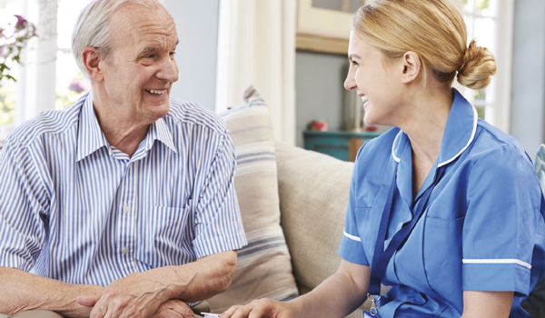 a man and a woman looking at the camera